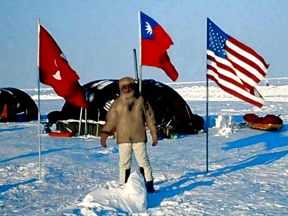 A man Standing  at Camp Borneo, base camp to the North Pole