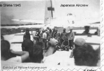 the whole japanese aircrew stands behind their betty bomber on the island of ieshima