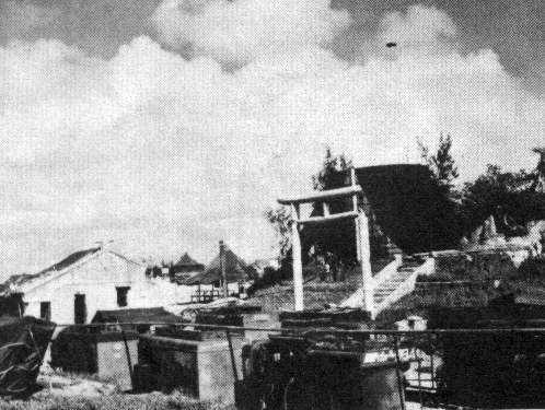 A Japanese Temple on the Island of Ie Shima in WWII, it this a UFO picture in the background