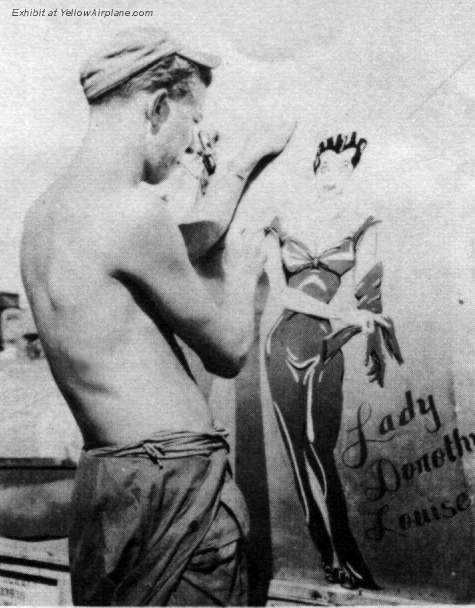 Artist painting Nose Art on a P-47 Thunderbolt Fighter Aircraft in WW2