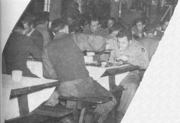 Photo of Soldiers eating chow at Bluethenthal Field, North Carolina