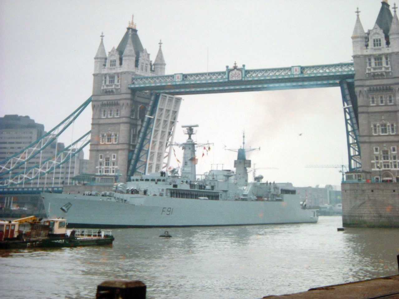 HMS Brazen going under the Tower Bridge in London