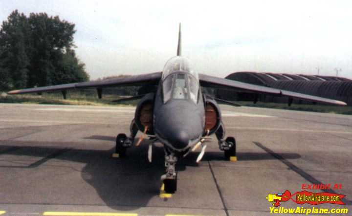 A front view of the alpha jet showing its drooping wings and intake covers
