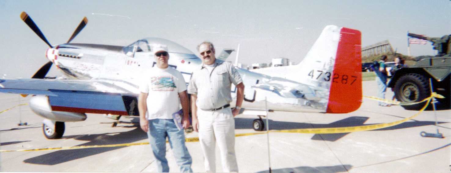 John Bybee on the left in front of a P-51 Mustang