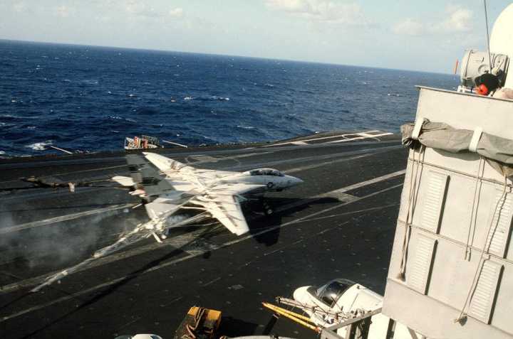 F-14 Tomcat being caught in the net on the USS Kitty Hawk