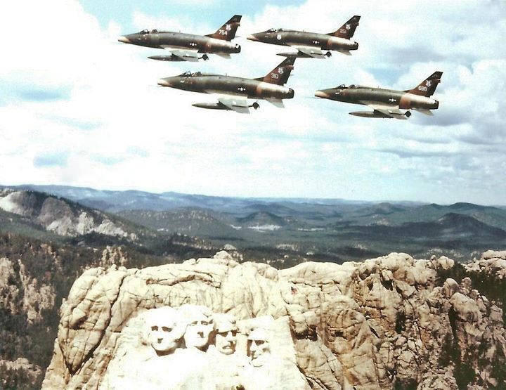 Huns over Mt. Rushmore. A friend of mine who was with the SDANG and my former Banker is flying the plane in the forground.