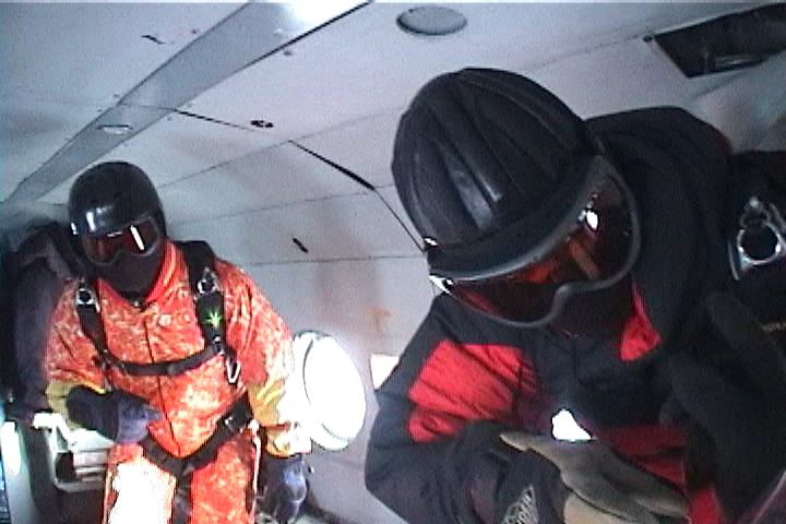 Skydivers preparing to jump to the ultimate drop zone, the North Pole.