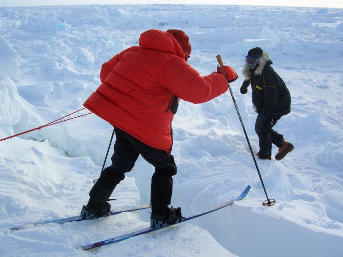 Skier cross a pressure ridge on his race to the north pole