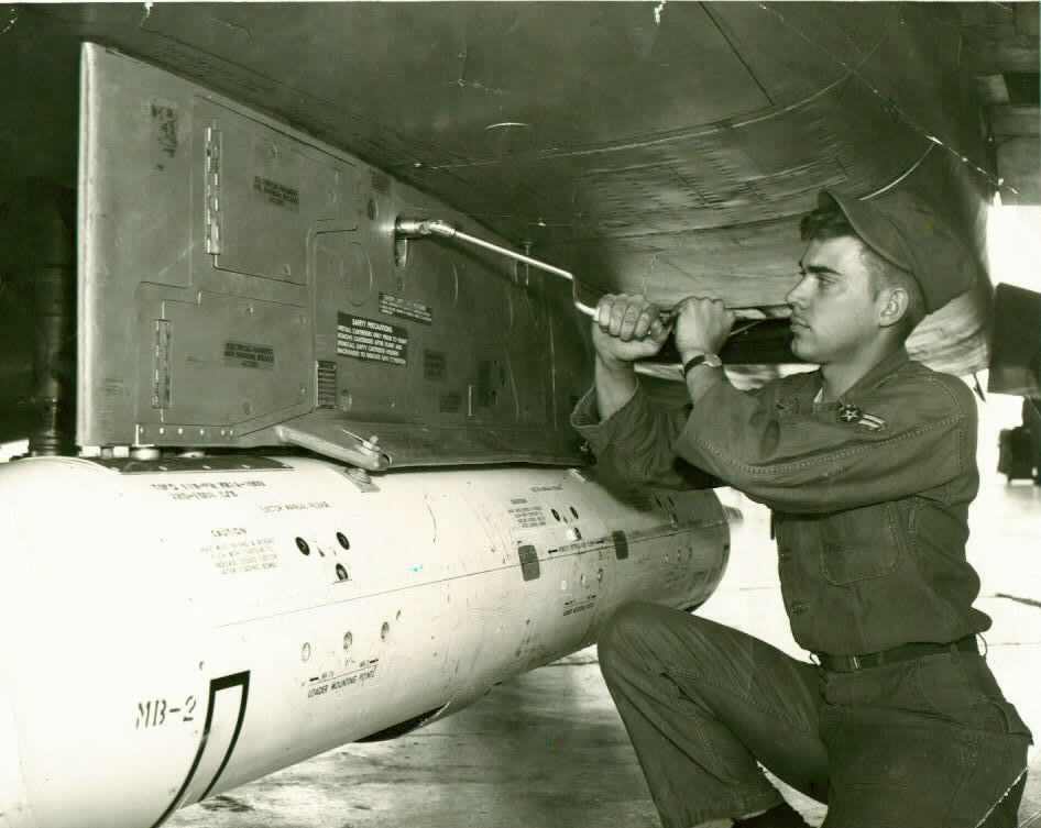 Pete Byam working on an F-100 Super Sabre Jet Fighter