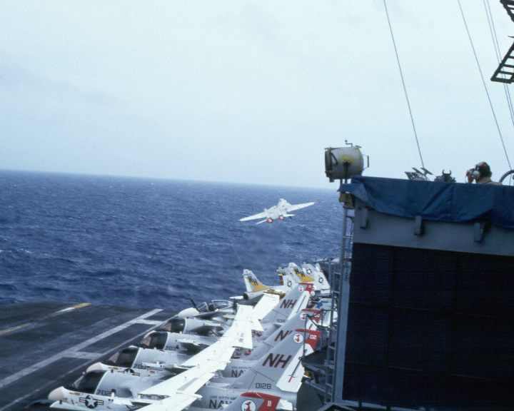 The alert 5 takes off of the uss kitty hawk, the S-3 viking aircraft, screw birds, are in the fore ground on the USS Kitty Hawk