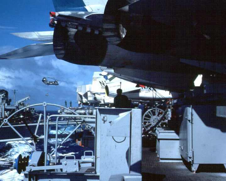 I can see 1 F-14, 1 A-7, and 4 A-6's from the catwalk of the Aircraft Carrier the USS Kitty Hawk